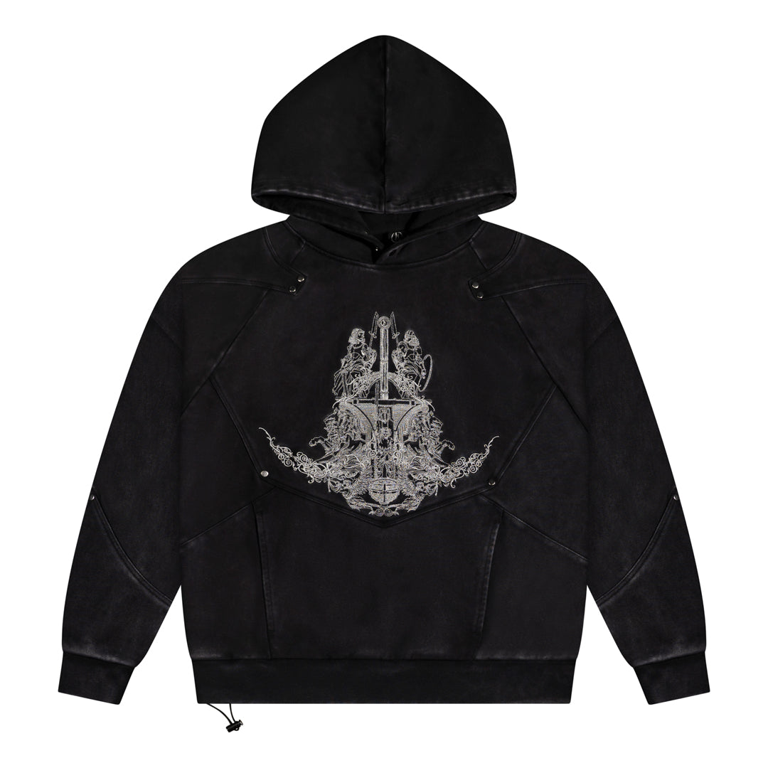 Black hoodie with a decorative emblem on the chest against a white background