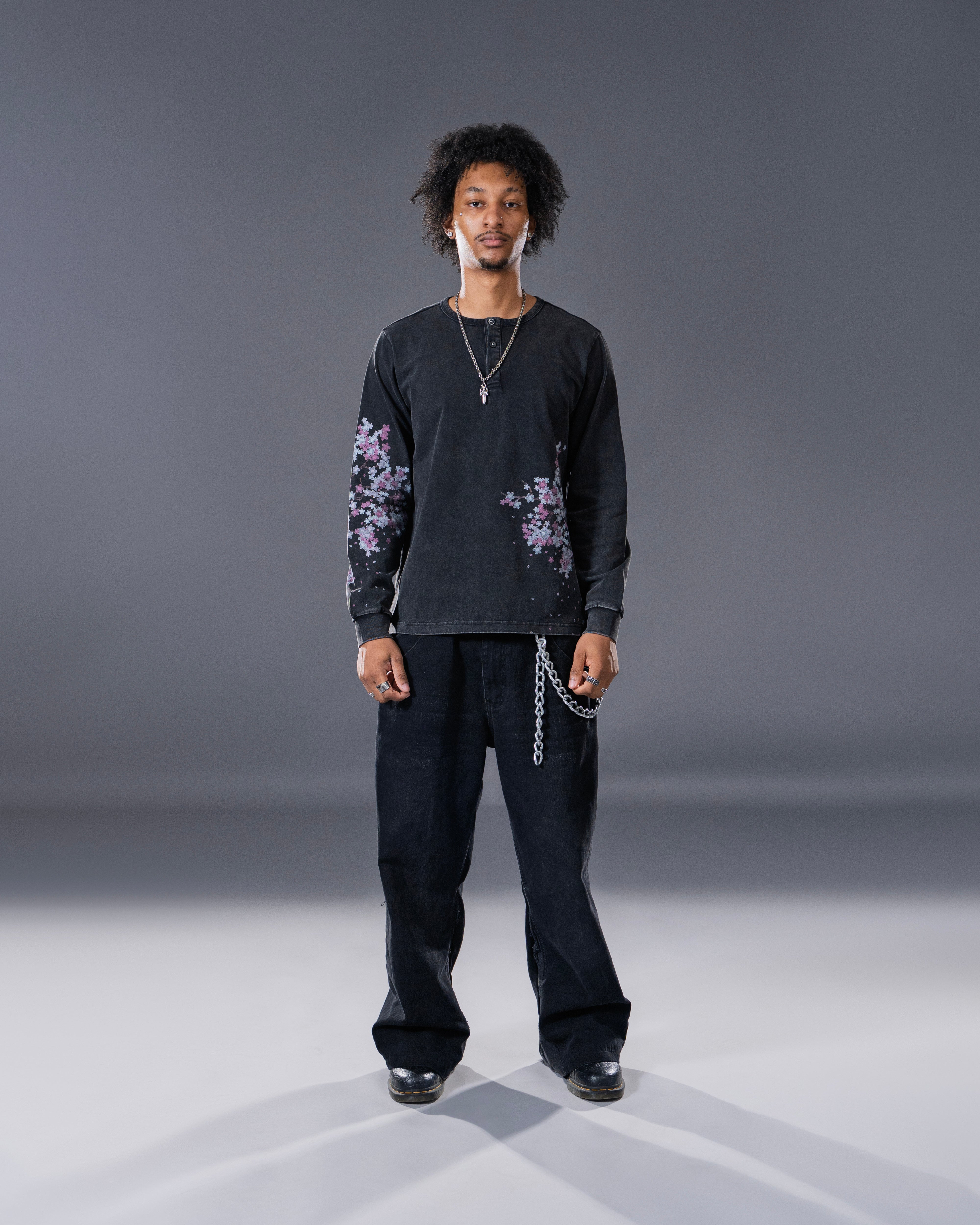 Black Henley long sleeve cotton tee with printed cherry blossom flower.