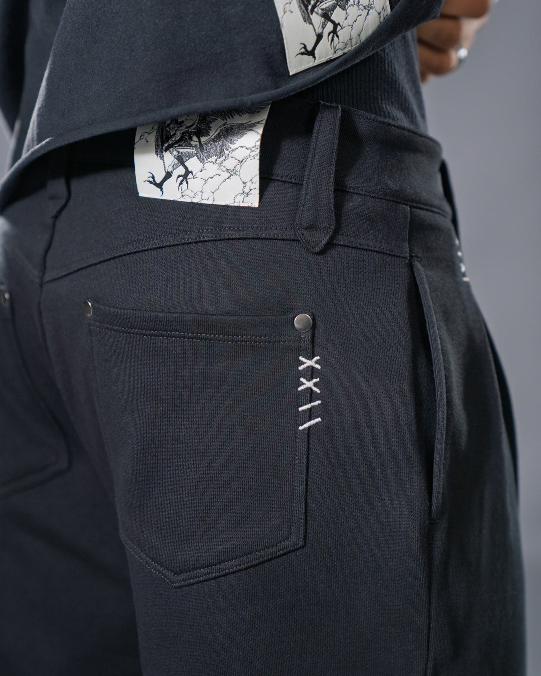 black pleated bootcut straight leg trousers