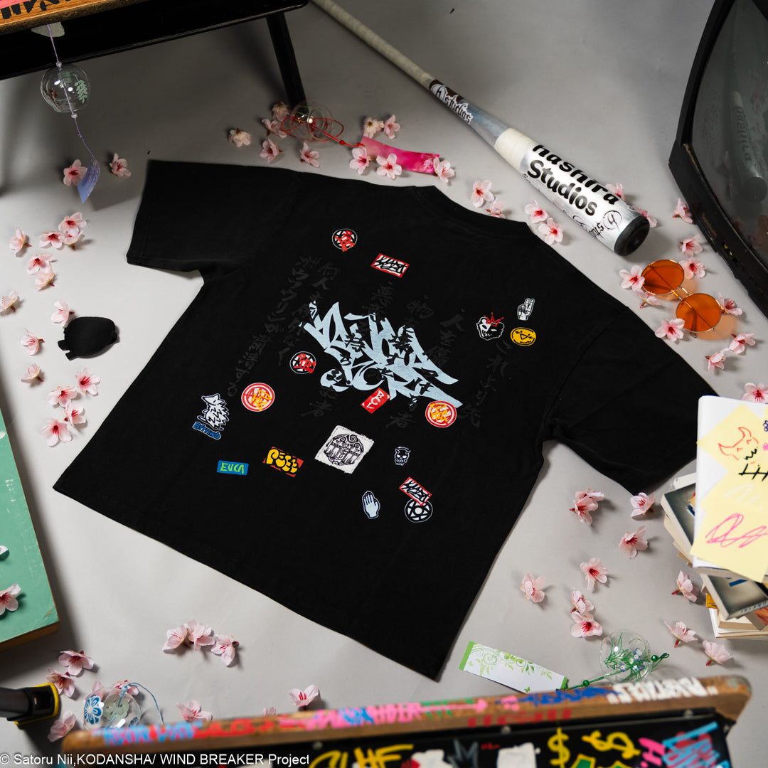 Black t-shirt with colorful graphics on the back.