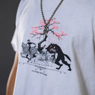 Vintage washed off-white mid length tee with original huntsmen fantasy inspired illustration with cherry blossom tree. 