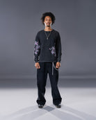 Black Henley long sleeve cotton tee with printed cherry blossom flower. 