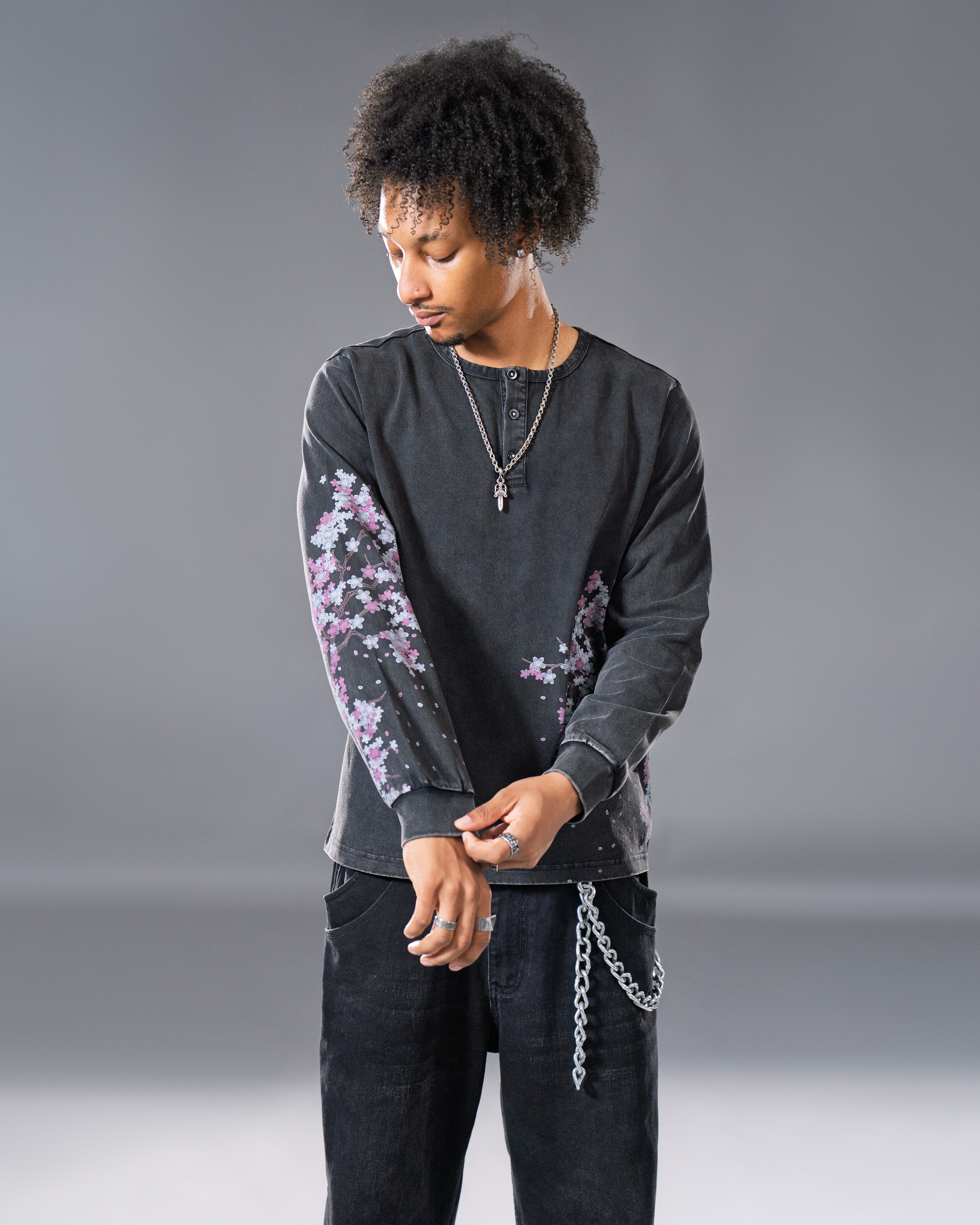 Black Henley long sleeve cotton tee with printed cherry blossom flower. 
