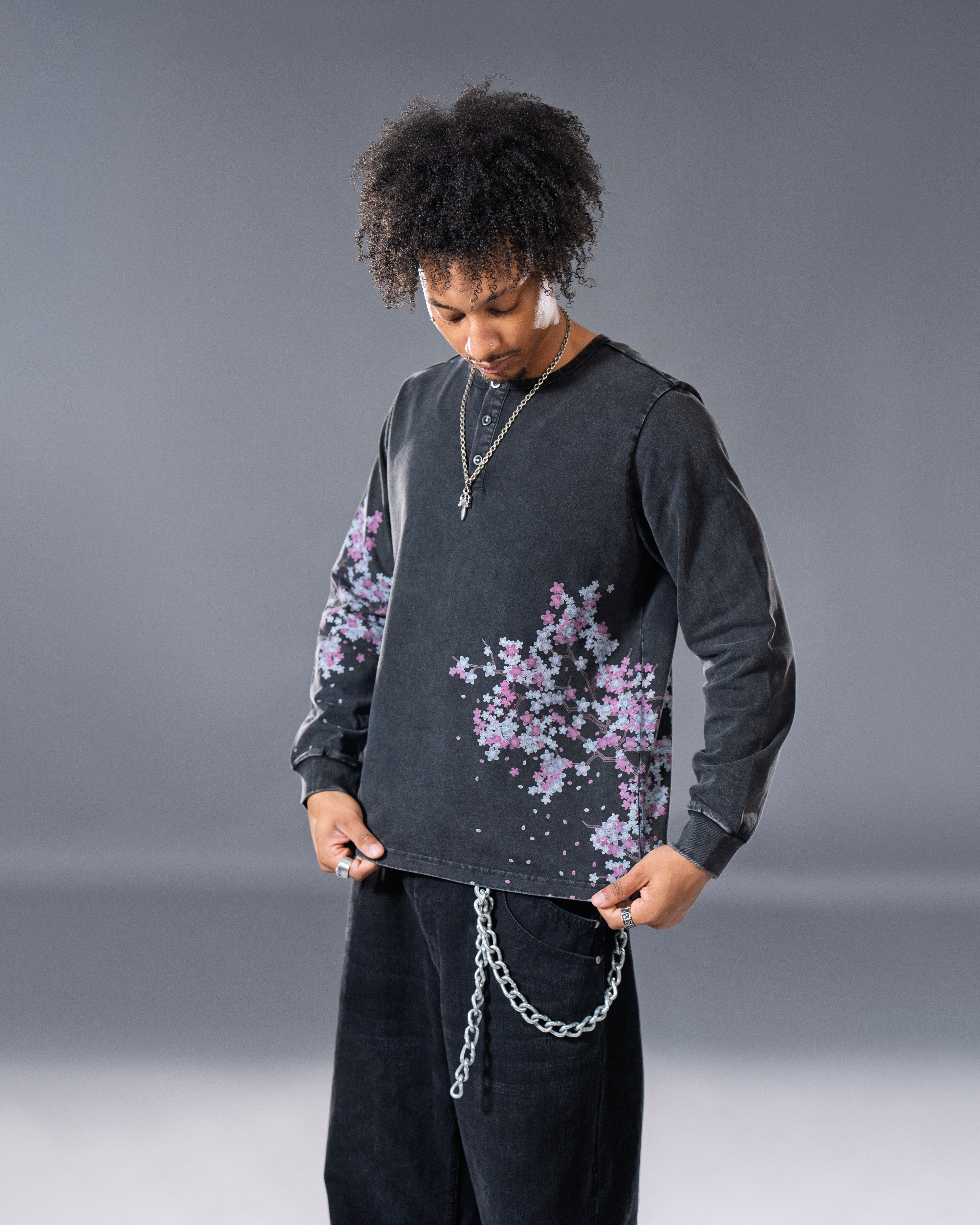 Black Henley long sleeve cotton tee with printed cherry blossom flower. 
