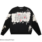 Black sweater with white and red pattern on a white background