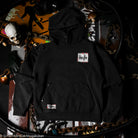 Black hoodie with a logo on a dark background