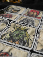 Close-up of embroidered patches on hoodie with a detailed design.