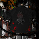 Black t-shirt with a skull and crossed tools design with red details on a dark background