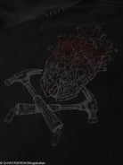 Dark t-shirt with a white print design of a character and crossed tools on a black background.