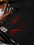 Black t-shirt with red design and brand logo on a dark background