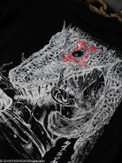 Close-up of a detailed lizard illustration with a red mark around eye, on a dark background.
