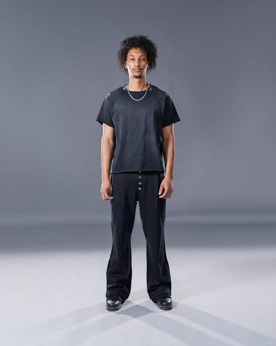 black pleated bootcut straight leg trousers