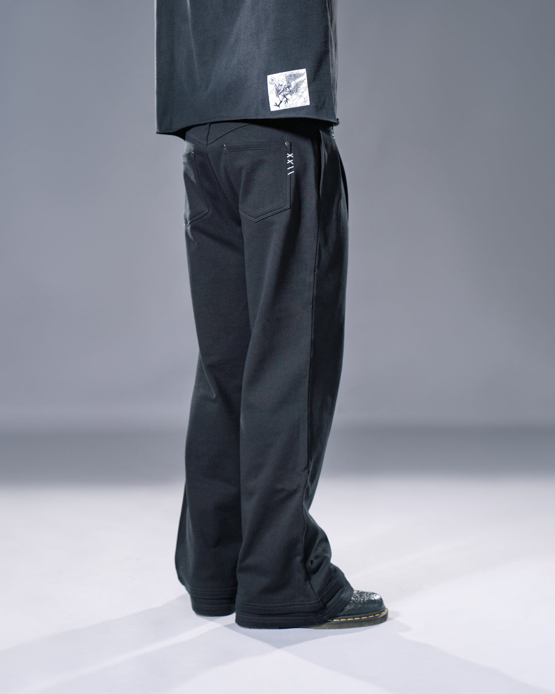 black pleated bootcut straight leg trousers