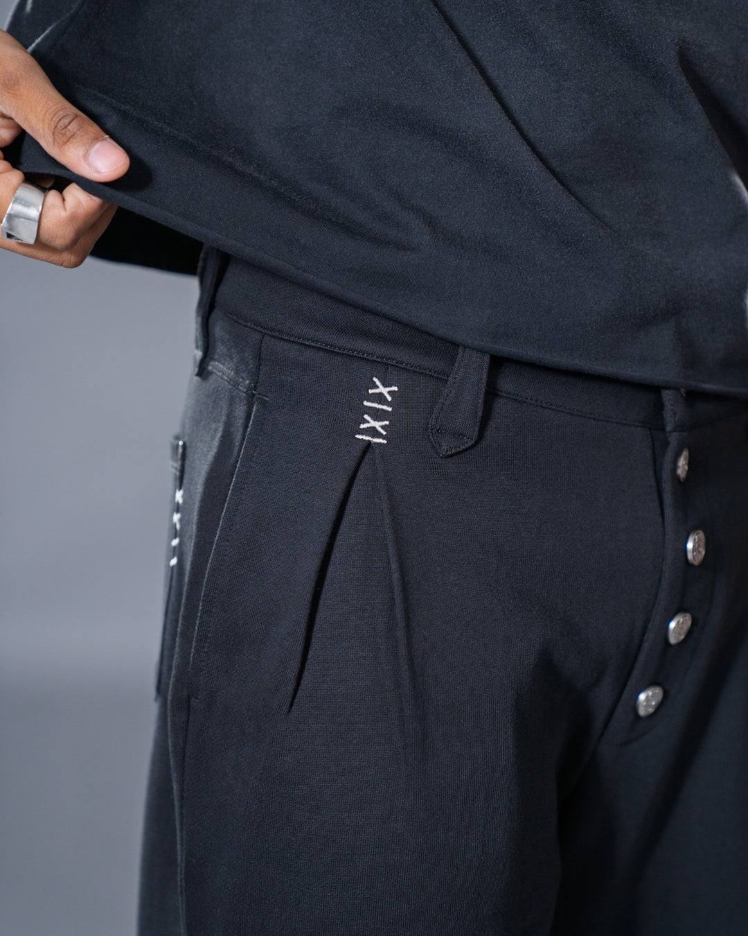 black pleated bootcut straight leg trousers