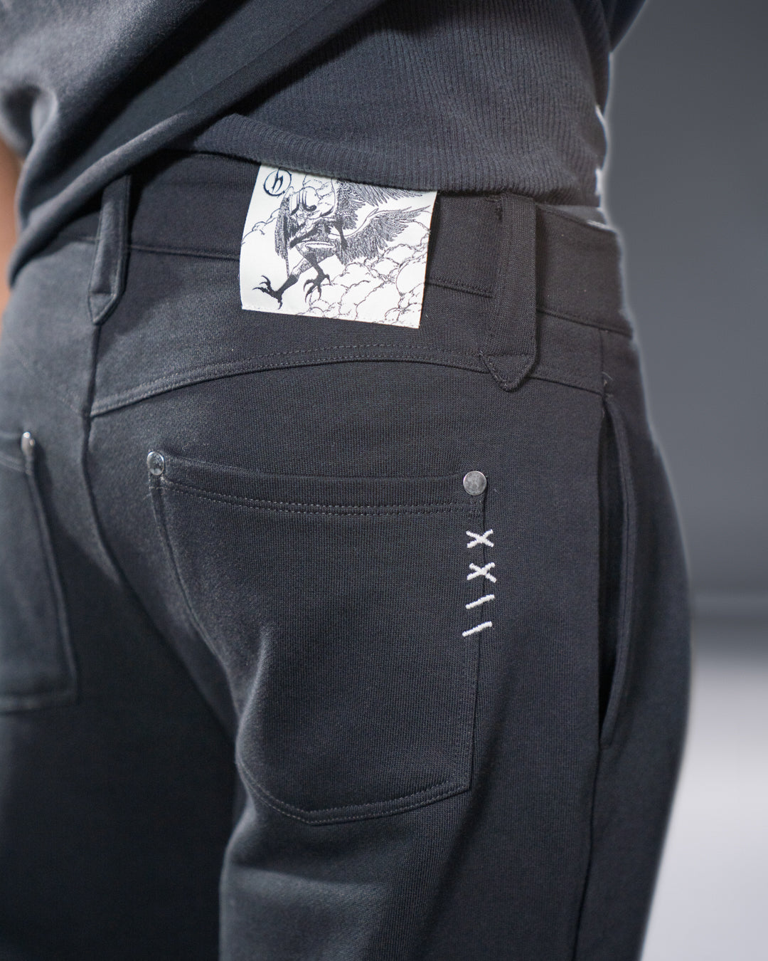 black pleated bootcut straight leg trousers