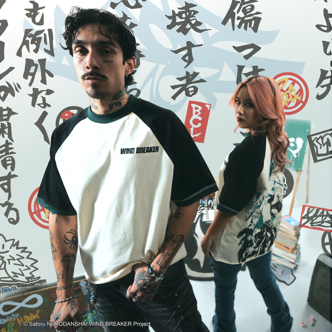 Two people wearing matching t-shirts with a graphic design on the back.