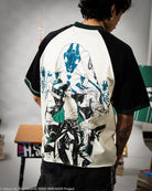 Person wearing a black and white baseball shirt with graphic design, standing in an indoor setting.