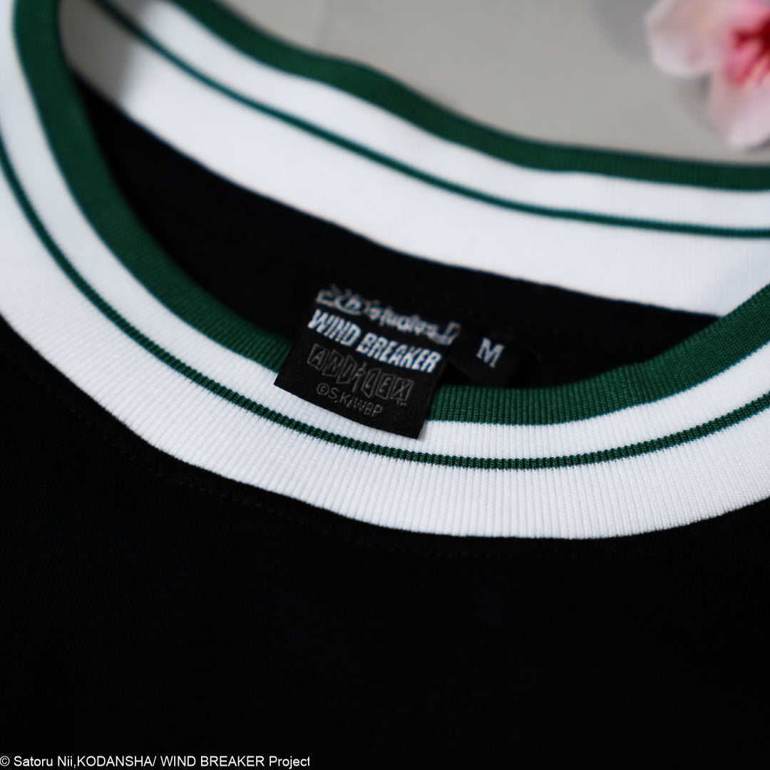 Close-up of a green and white striped shirt with a label on a black background